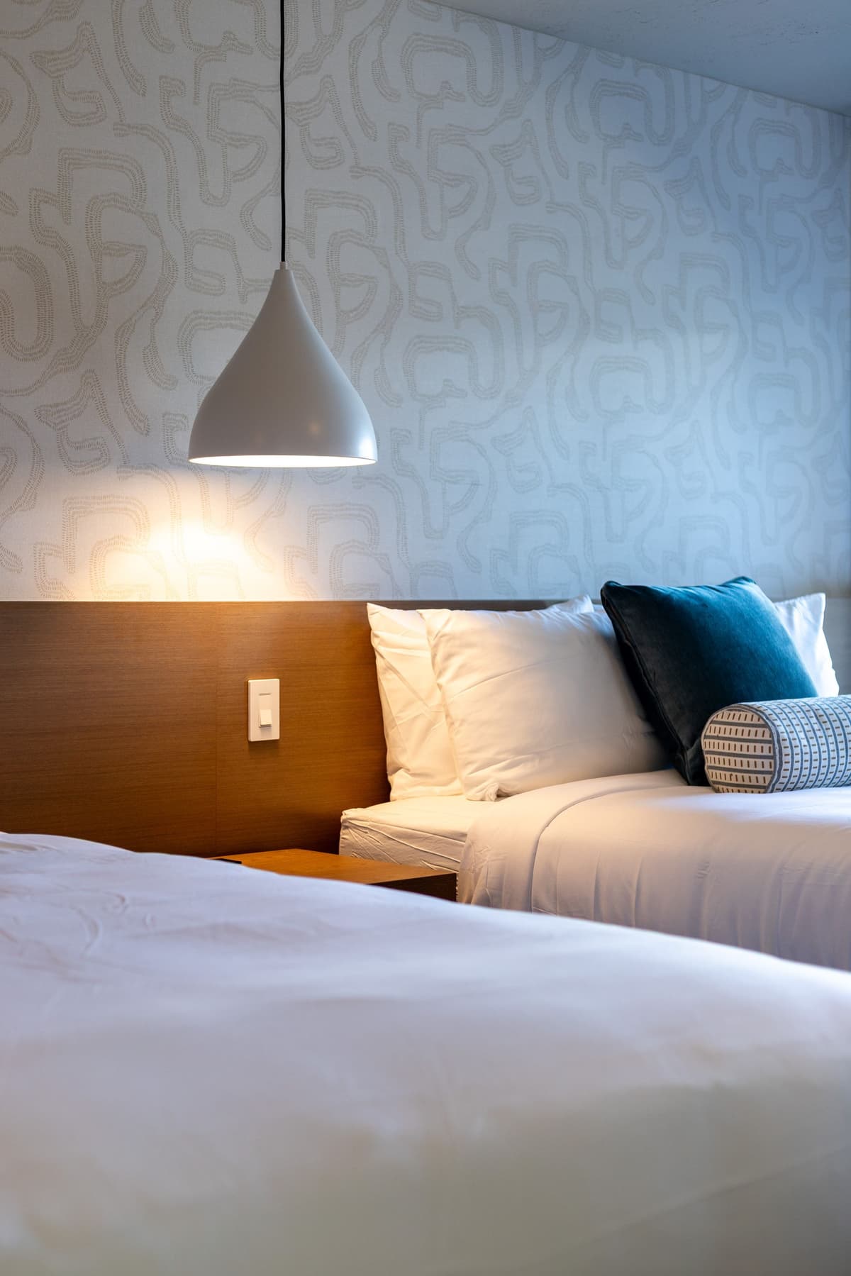 Bed and pendant light detail at Adobe Desert Motel